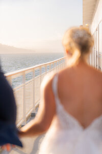 san francisco wedding cruise bride and groom walking along side of boat