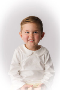Little boy poses for Heirloom Photography session in Charleston, South Carolina.