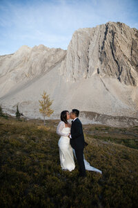 Couple embracing at sunset in the hills.