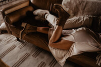 In home engagement session in Sedona AZ - boots cuddling and legs entangled