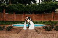 Bride & Groom in front of the fountain at Gardencourt. One of Louisville's top venues.