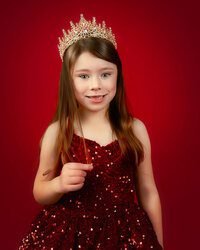 Child wearing crown in studio portrait session in New Bern NC