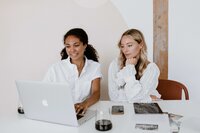 Two women working together on a laptop computer | Venue Business Boot Camp