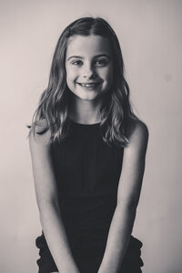 Young girl smiles at the camera during Personality Portrait Photoshoot in Charleston, SC.