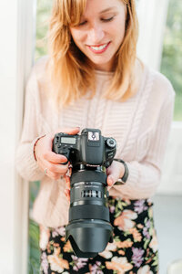 Branding fotografie van een fotograaf met camera duidelijk in beeld