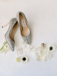 Jimmy Choo heels and bridal jewelry flat lay
