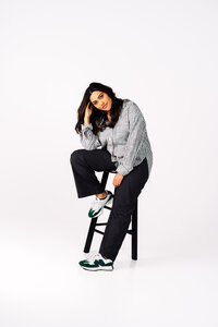 Marketing agency owner photographed in a modern studio portrait for her personal brand.