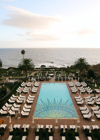 Wide-angle view of a large-scale brand event set at a resort, showcasing tables, layout, and location
