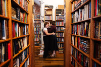 Couple photos at bookstore.Prosperos Books Engagement Photos.Kansas CIty Wedding Photographer.Caitlyn Cloud Photography4