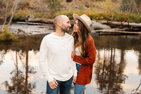 engaged couple next to Deschutes river