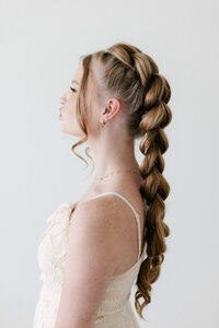 Close-up of detailed braiding work showing expert styling and creativity by the SoCo hair team