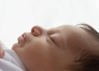 Image of sleeping baby at a studio newborn photography session by Hobart Newborn Photographer Lauren Vanier