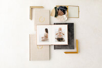 Open heirloom portrait album showing studio session photos from Andrea Krey Photography in Niceville, Florida