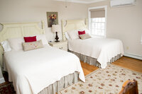 Guest room with two full beds at Crossed Keys Inn ideal for wedding party or family lodging