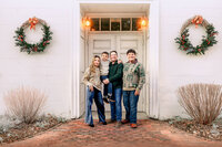 Father standing with his children during a golden hour family session in New Bern NC