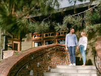 A serene engagement moment at The Lodge at Torrey Pines captured by Michael Asmussen Photography. Amid whispering pines and timeless California architecture, the couple celebrates with rosé and effortless laughter—an image of warmth, elegance, and genuine connection.