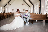 Bride and Groom exchanging private vows in a chapel at The Barn At Paradise Place captured by Graceful Ray Photography in Fort Worth Texas