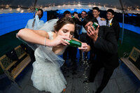 Bride and groom drinking beer at wedding reception