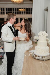 couple cutting cake Belle Mer wedding reception