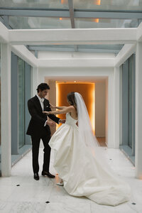 Sophisticated digital wedding photography capturing fashion forward moments during Rebecca & Kevin's luxury destination celebration at Miami Beach Edition resort.