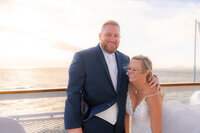 san francisco wedding cruise bride and groom smiling on deck