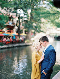 Young couple embraces  during New Orleans anniversary photography session