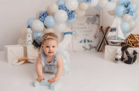 Baby celebrates her 1st birthday with a Cake Smash Photoshoot at Holy City Babies Portrait Studio in Charleston, SC.