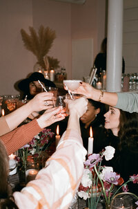 Unique Melody Events & Design team (New England Wedding & Event Planners) raising their glasses for cheers