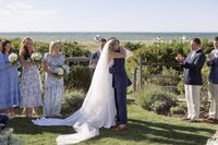 Bride and Groom embrace during wedding ceremony on Nantucket.