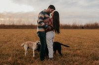 photo of a couple and their dogs during their engagement photoshoot in Bloomington, Indiana.