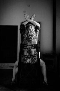 Boudoir experience studio seated on stool facing back