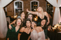 bride and bridesmaids celebrating together