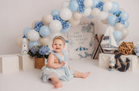 Baby celebrates her first birthday with Cake Smash Pictures at Holy City Babies Portrait Studio in Charleston, SC.