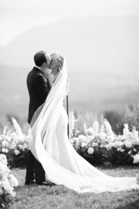 Bride and groom share their first kiss as newlyweds