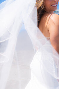 bride with veil in front of san francisco city hall wedding