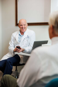 Branding image of a Bend Oregon medical or service professional consulting with a client