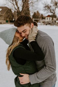 Couple kisses during a winter photo session.