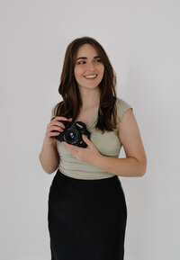 Portrait of Sierra Greenlee holding a camera.
