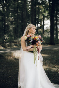 Bride with bouquet by Flowergirl Cville at Keswick Vineyard wedding near Charlottesville, VA | Photo by Abby Hart Photography
