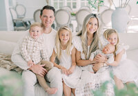 beautiful-family-sitting-white-living-room-orange-county_01