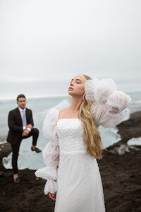 woman (bride) posing at Diamond Beach Elopement Iceland wedding photographer