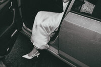 Bride arrives at for Calridges wedding in London, showing foot leaving wedding car