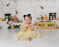 From frosting-covered fingers to the happiest birthday twirls, this bee-themed session was buzzing with joy. Captured by Yucaipa cake smash photographer Kaitlyn Dawn Photography.