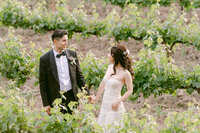 An unforgettable wedding moment surrounded by lush bougainvillea and golden light—captured with soft elegance by Los Angeles Top Destination Wedding Luxury Photographer Michael Asmussen. From Temecula Valley Wine Country to Tuscany, Italy this image embodies timeless beauty, couture bridal styling, and modern romance with a soulful lens.