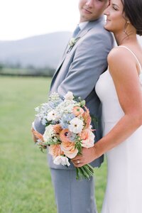 Bridesmaid bouquet detail with peach roses, pink dahlias, and white cosmos by Flowergirl Cville, Charlottesville VA wedding florist | Photo by Paige Ryan Photography