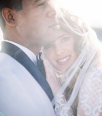bride getting blush put on her cheek