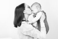 Sherwood Park studio family portrait of mother holding her baby close