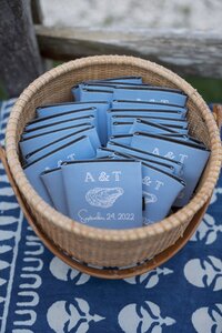 Blue monogrammed drink cozies.