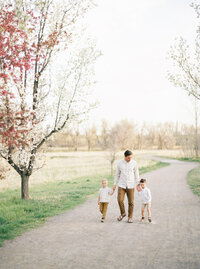 Father walking with children during Denver family photo session.