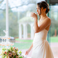 editorial bride drinking champagne at hollins house in santa cruz